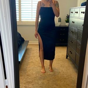 Little black dress with high slit.